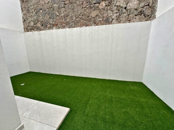 jardin de casa con recámara en planta baja Zibatá Querétaro. En Entrecielos